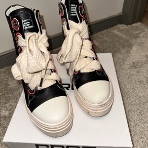 Converse Black and White High-Tops with Red Highlights